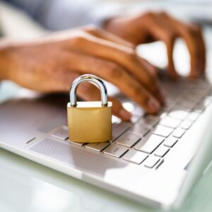 Board member typing on keypad that has a lock on top signifying data privacy