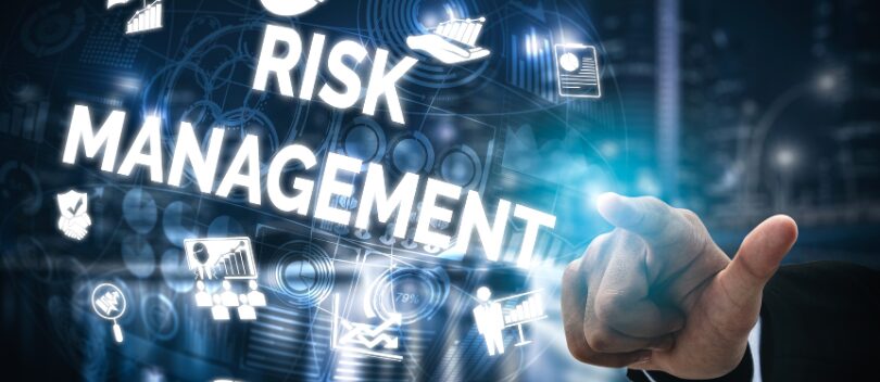 Risk Management digital graphic with human hand pointing